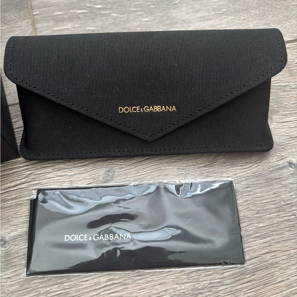 Dolce & Gabbana sunglasses case and a box.